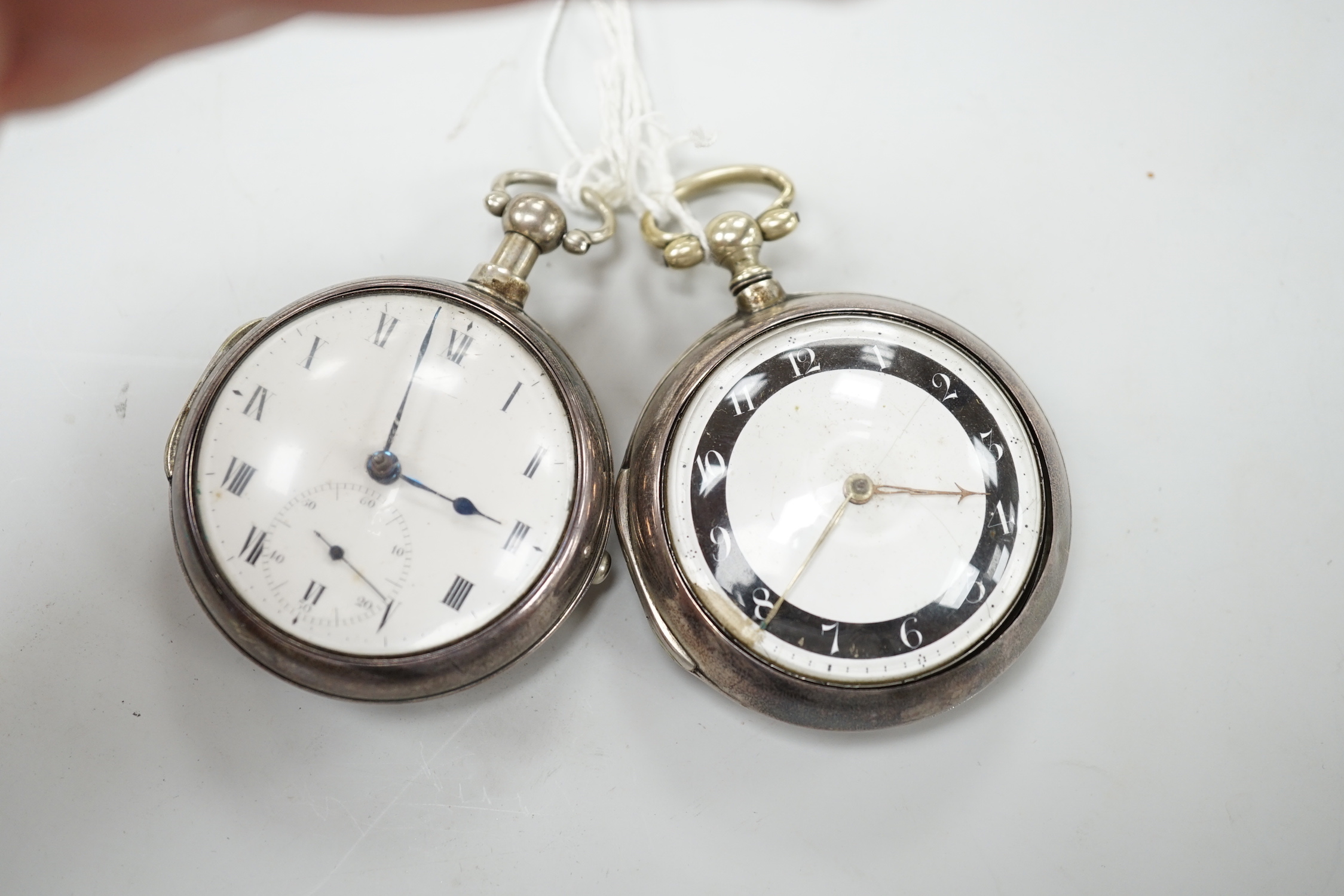 Two George III silver pair cased keywind verge pocket watches by Knight of Thaxted (black ring) and Spink of Windsor.